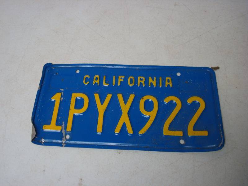 lot 76 image: California License Plate, Has Bend On It