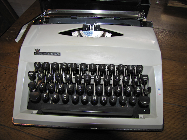 Vintage Contessa Adler typewriter and case