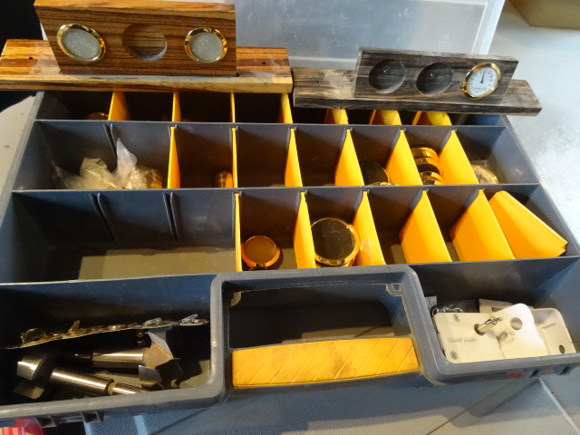 Locking hardware bin with materials