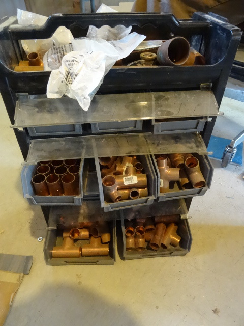Bin full of 34 copper plumbing fittings