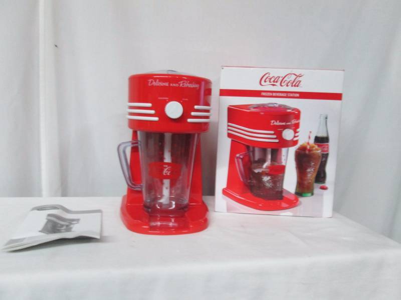 lot 61 image: Nostalgia Electrics Coke Frozen Beverage Maker