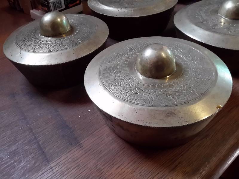 lot 64 image: Four Decorative Brass tops.