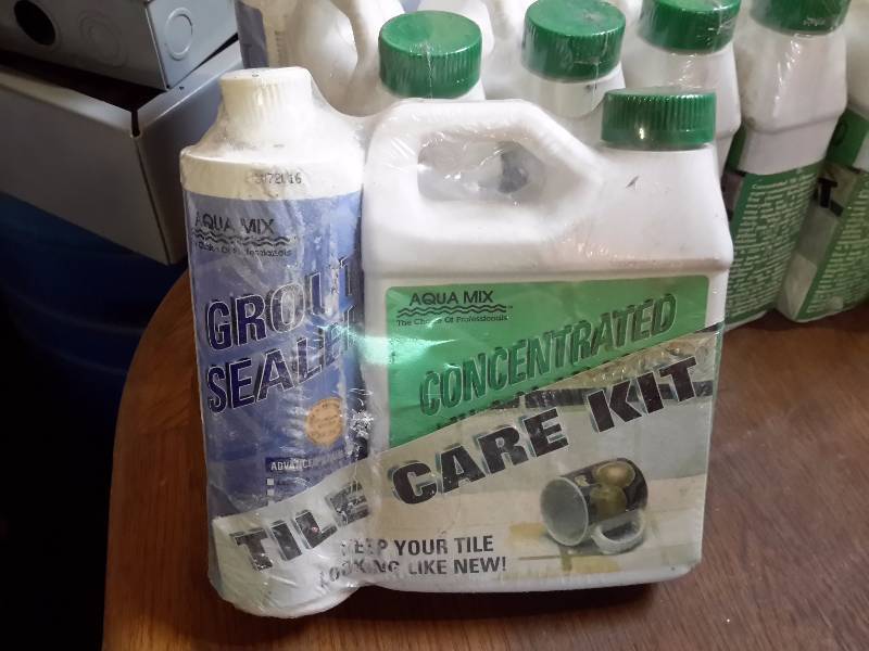 lot 66 image: 9 Tile Care Kits.. New