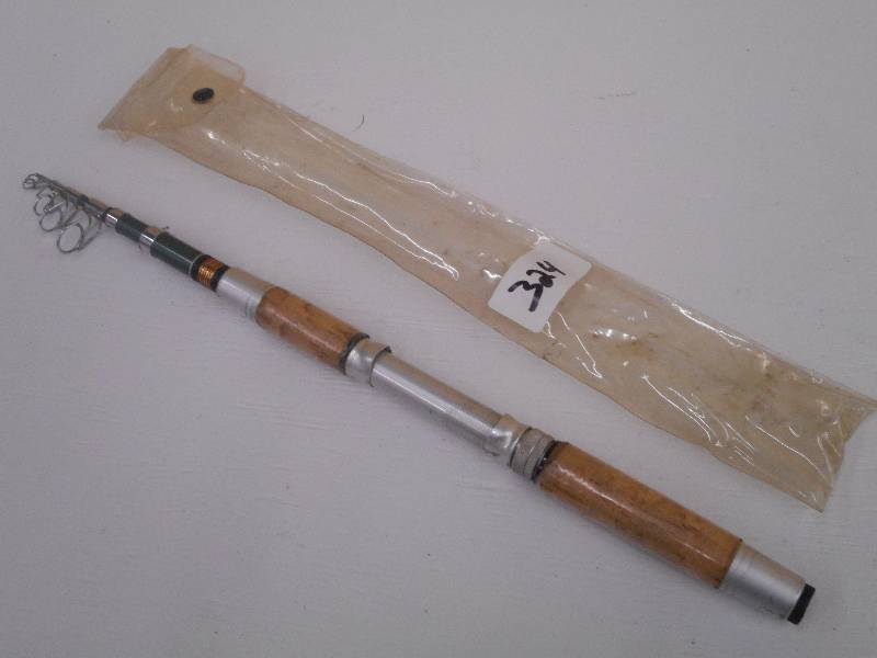 lot 324 image: Unmarked Telescoping Fishing Pole, ...