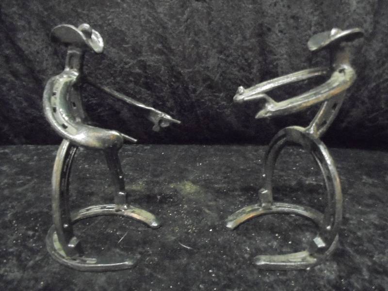 lot 49 image: Pair - Metal Horshoe Cowboys