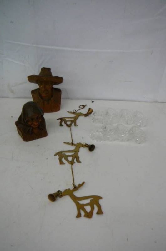 lot 52 image: Brass Hanging Reindeer Bells 8 Napkin Holders old man and old lady wood carving