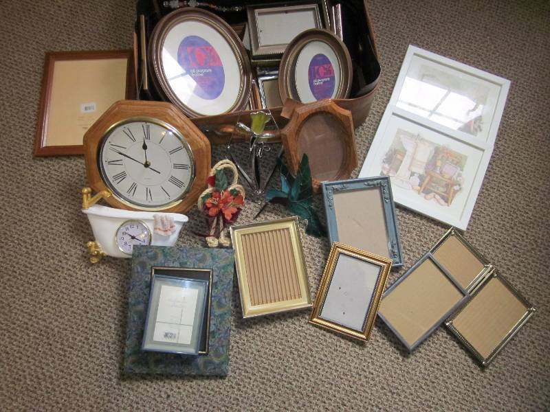 Suitcase of small frames and wall decor