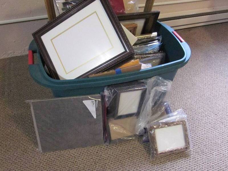 Tub of frames, mattes, and glass