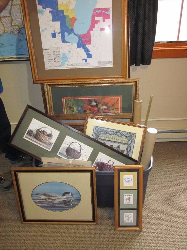Tub of framed art prints