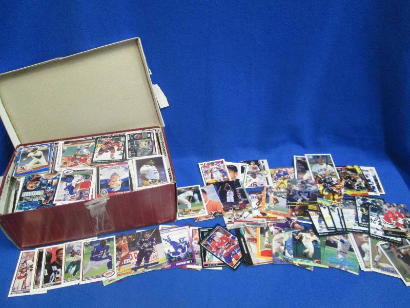 shoe box full of assorted sports ca...