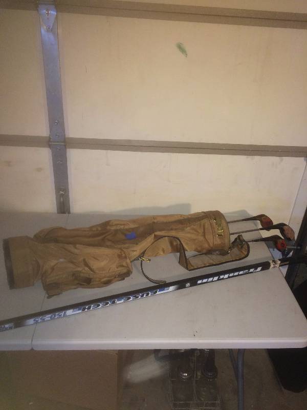 Golf clubs, bag and hockey stick