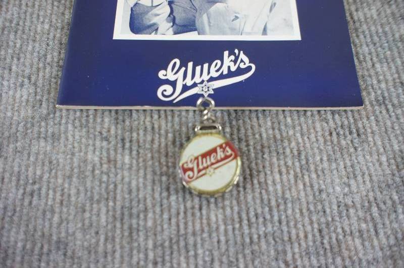 lot 23 image: Gluek Beer Cookbook and Bottle Cap
