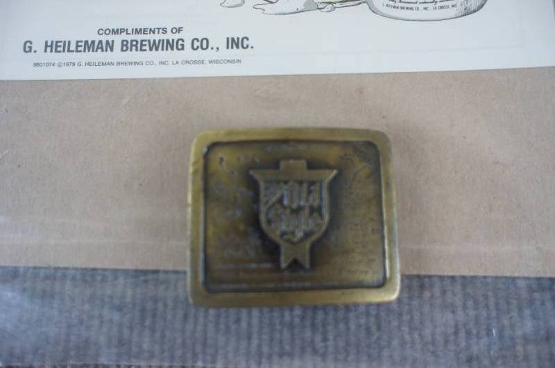 lot 38 image: Ols Style Beer Song Book and Belt Buckle