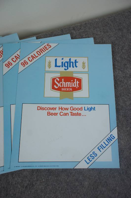 lot 40 image: Stack of 25 Schmidt Beer Price Signs