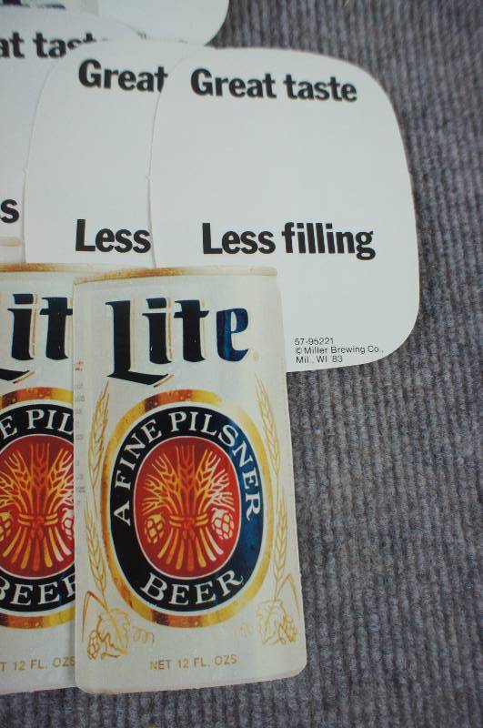 lot 48 image: Pile of Miller High Life and Miller Lite Adhesive Stickers