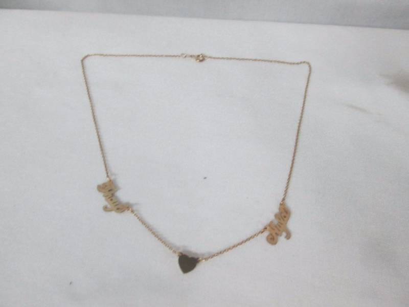 lot 68 image: 24K Gold-Plated Silver Couples Name Necklace