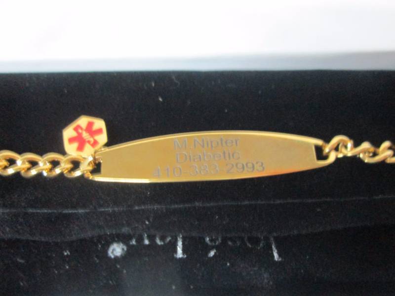 lot 63 image: Ladies Goldtone Steel Medical ID Bracelet