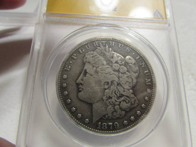 lot 47 image: 1879 CC F-12 Silver Dollar