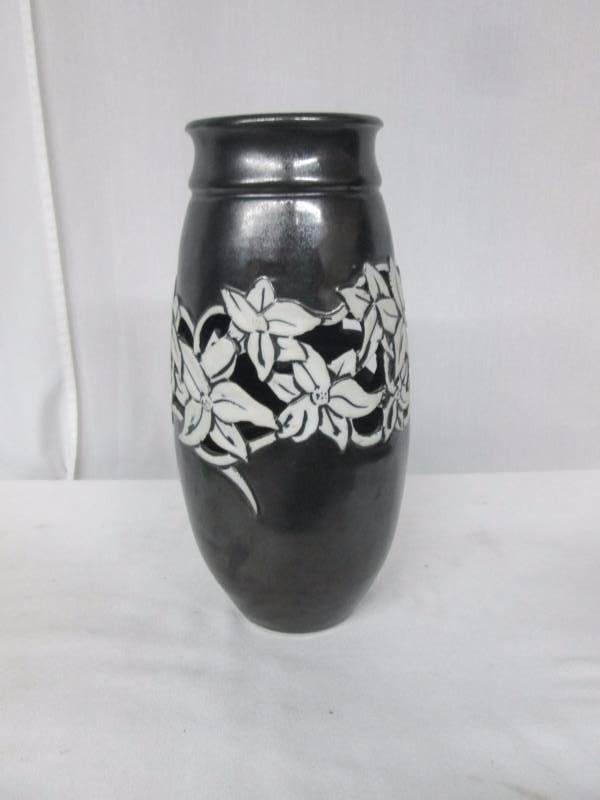 lot 68 image: Grey Vase with White Flower Decor