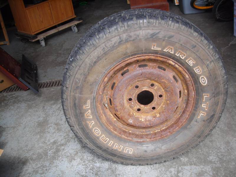 lot 57 image: Chevy 12 Ton Pick Up Full Size Spare (UniRoyal Laredo LTL Tire 245-7516)