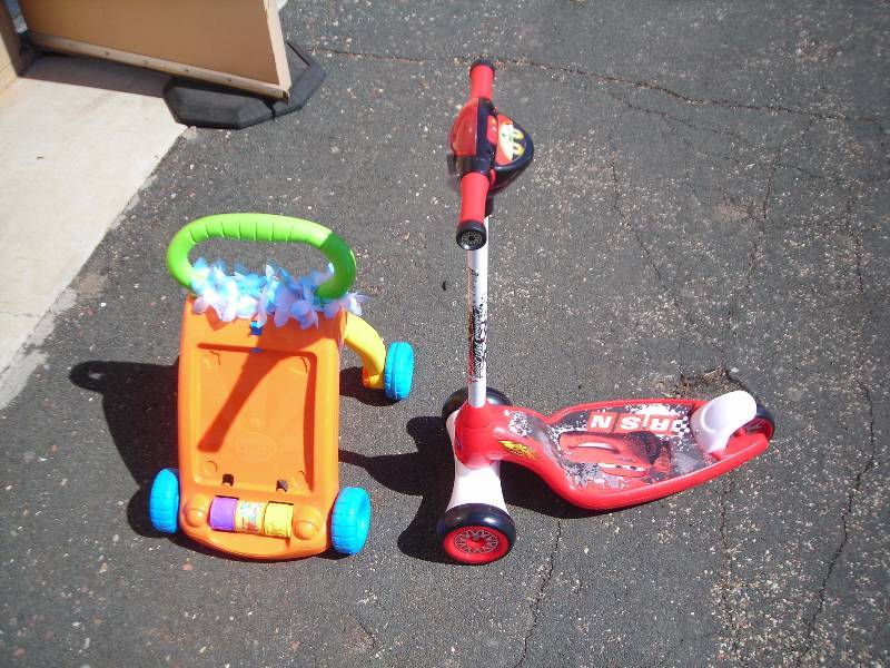 lot 60 image: V-Tech Walker, Huffy-Lightning McQueen Scooter (with sounds)