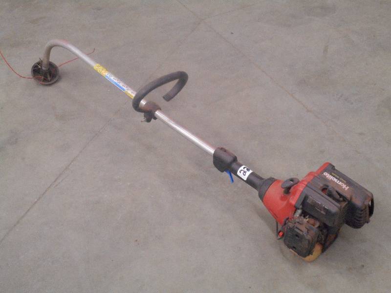 lot 22 image: Homelite Gas Grass Trimmer ...