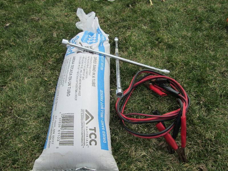 lot 71 image: Sand Bag, Jumper Cables, Tire Wrench