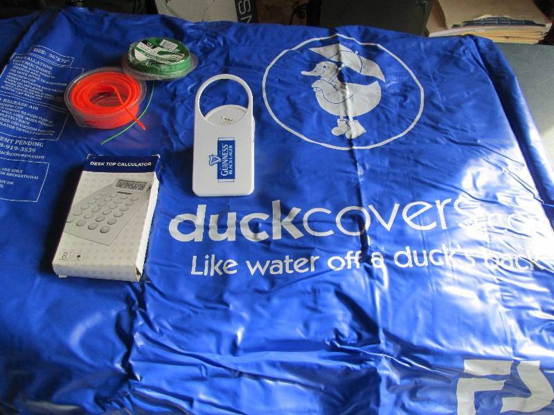 lot 113 image: Weed Whip, Duck Cover, Calculator