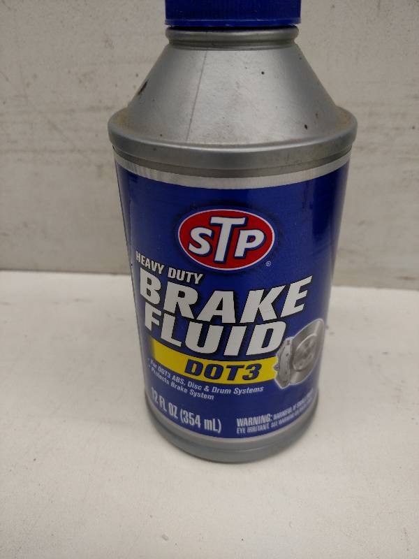 lot 206 image: 12 oz. STP Dot3 Brake Fluid...
