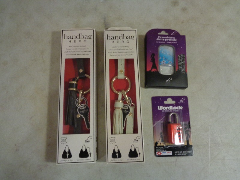 lot 24 image: 2 New Handbag Heros, New Personal Alarm, and New Word Lock