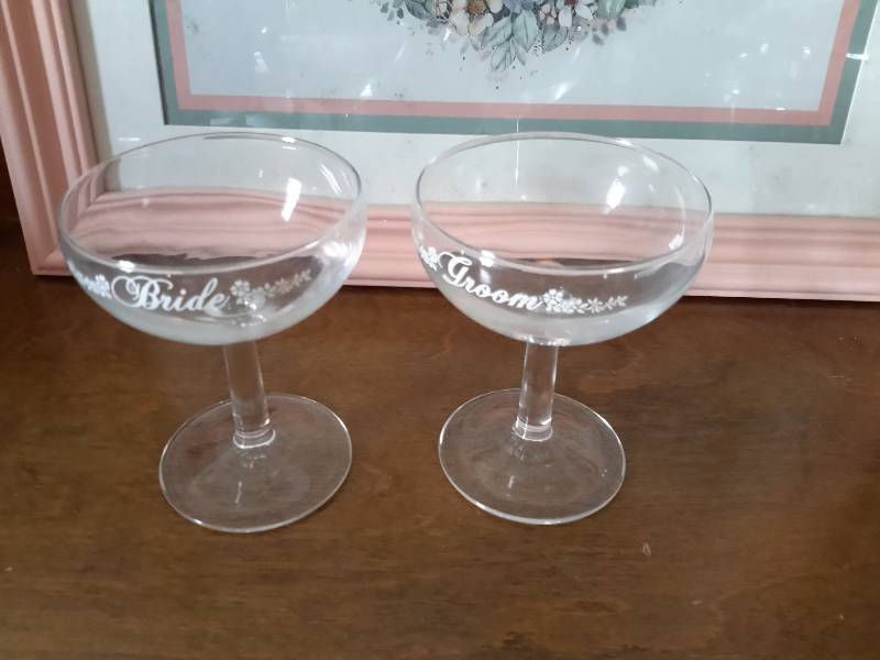 lot 34 image: Misc. LOVE pictures.  Glass Heart Shaped dish with cover.. Bride and Groom Champagne glasses.