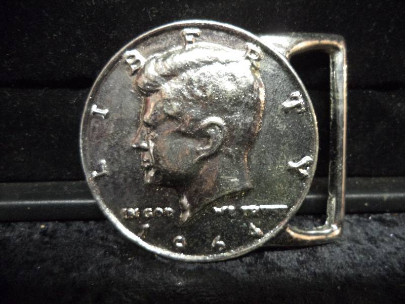 lot 83 image: Belt Buckle - 1964 Kennedy Half Dollar Coin