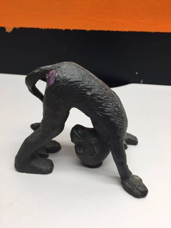 lot 4 image: MONKEYS CAST IRON