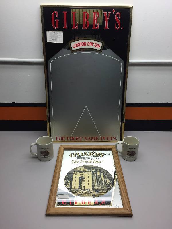 lot 21 image: LONDON GIN AND ODARBY IRISH CREME MIRRORS AND YUKON JACK MUGS