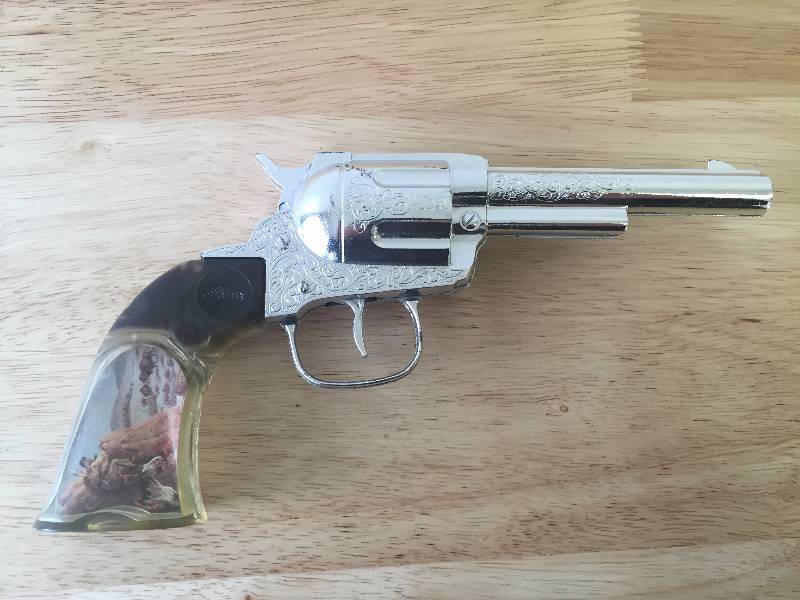 lot 12 image: VINTAGE DAISY CAP GUN WITH CLEAR HANDLES