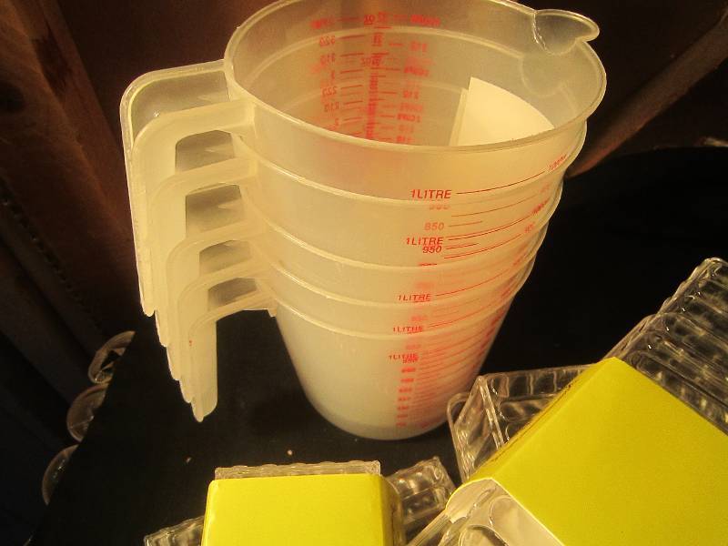 NEW LOT - 9 Butter Dishes, 5 Measuring Cups & 2 Ashtrays