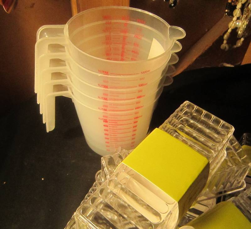 NEW LOT - 9 Butter Dishes, 5 Measuring Cups & 2 Ashtrays