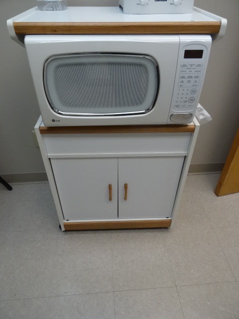 lot 91 image: Microwave cabinet on wheels.