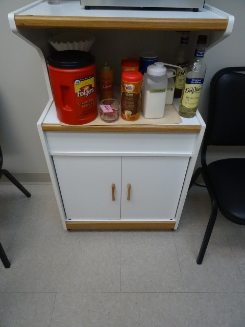 lot 92 image: Microwave cabinet on wheels.