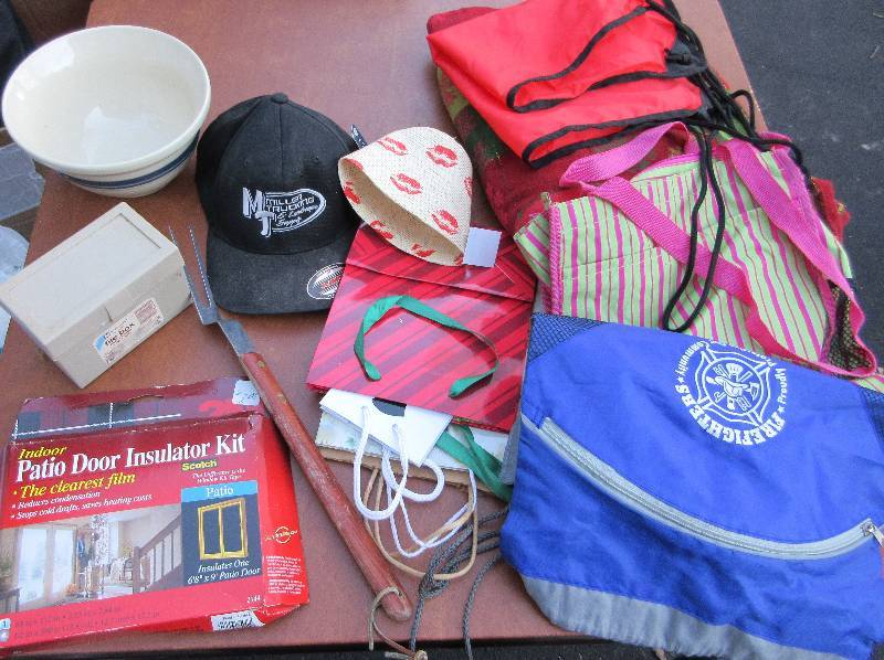 lot 704 image: MISC LOT OF BAGS, TABLECLOTH, ROSEVILLE BOWL, WINDOW INSULATION KIT, LARGE GRILL FORK, GIFT BAGS, ETC