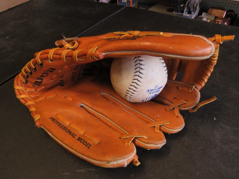 Softball glove and ball