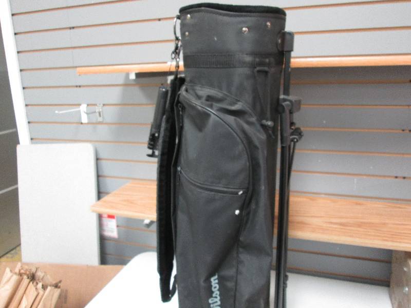 Black Wilson golf bag with club bru...