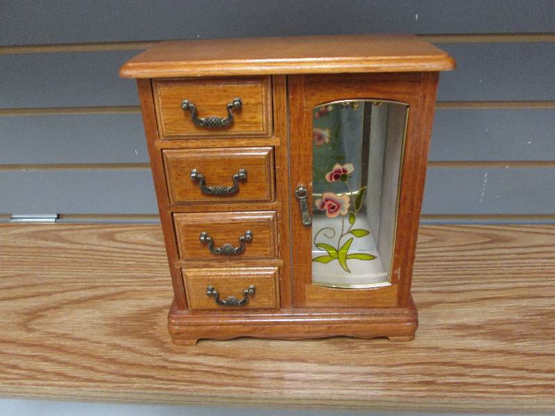 Beautiful wooden jewelry box with a...