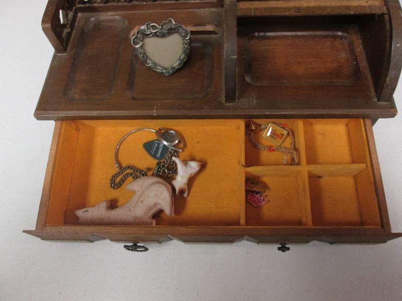 Wooden jewelry box with assorted it...
