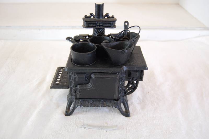 lot 144 image: Tiny Cast Iron Stove