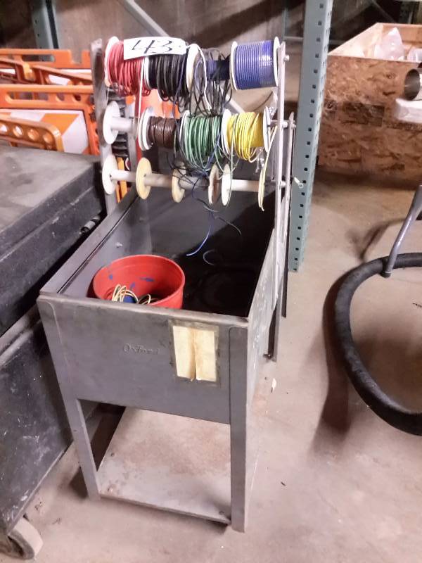 lot 43 image: Rolling metal cart with wire reels.. Wire included