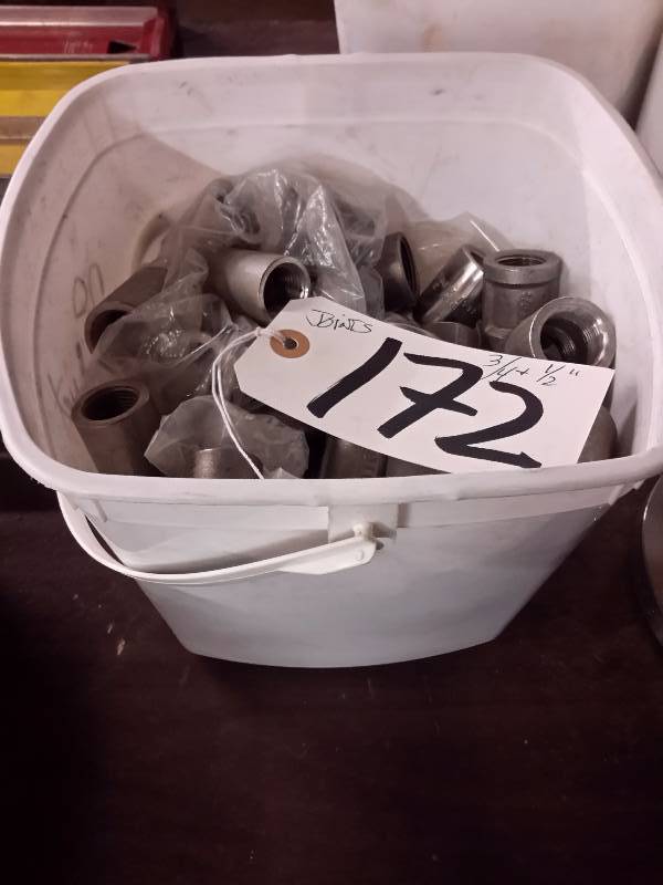 lot 172 image: Pail of Stainless steel  34in and 12in fittings