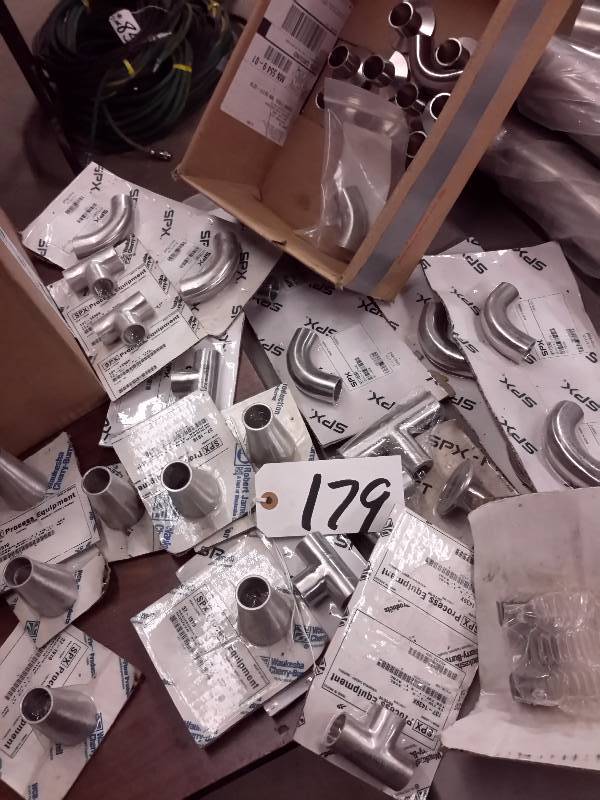 lot 179 image: Large lot of SPX, 1 in Stainless Steel Elbows and Ts and reducers.