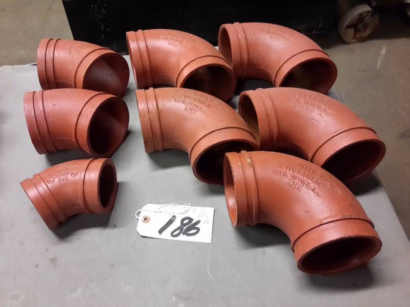 lot 186 image: 5, 4in 90 degree Victaulic Elbows  2, 4in 45 degree Victaulic elbows, 1, 3 in 45 degree Victaulic Elbow