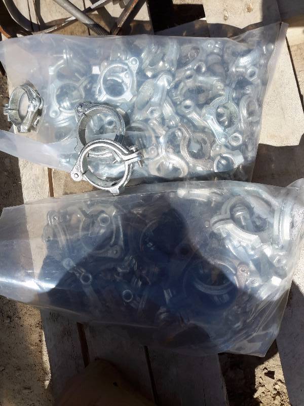 lot 326 image: 2 Bags of pipe hangers, and box of Hi Torq Soil Couplings